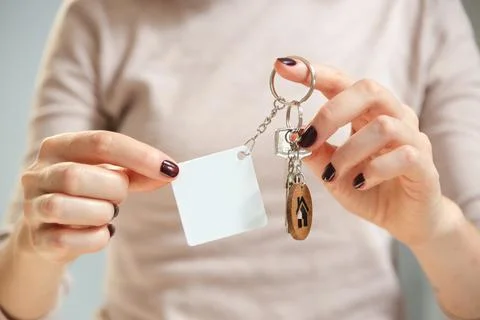 Keychain mockup to display design. Key chain mock up in woman hand. Blank Stock Photos