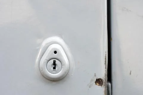Keyhole on an old car door Stock Photos