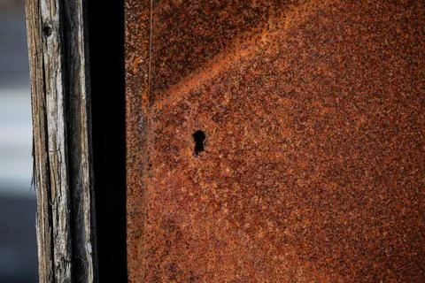 Keyhole of an old rusty junction box Stock Photos