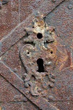 Keyhole in old rusty lock Stock Photos