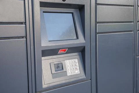 Keypad with numbers and screen at parcel station similar to atm and money Stock Photos