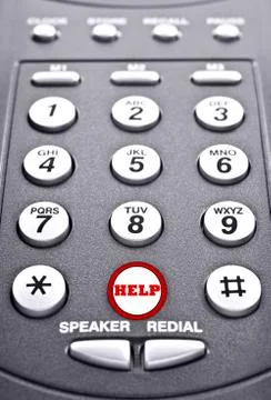 Keypad of a telephone with a red button for help Stock Photos