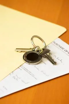 Keys and contract Stock Photos