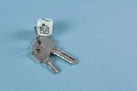 Keys and a cube with a house. the concept of real estate Stock Photos