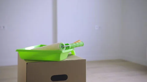 Keys and Paint Roller Box Reveal in New Room Stock Footage 313349402