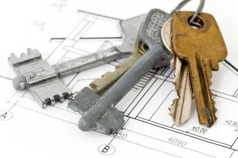 Keys on architectural blueprint Stock Photos