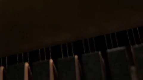 Keys beat the strings on the piano Stock Footage 128455795