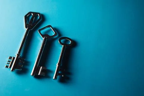 Keys on blue background. Minimal creative style Stock-Fotos