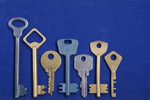 Keys on a blue background. Stock Photos