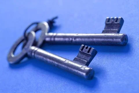 Keys on a blue background Stock Photos