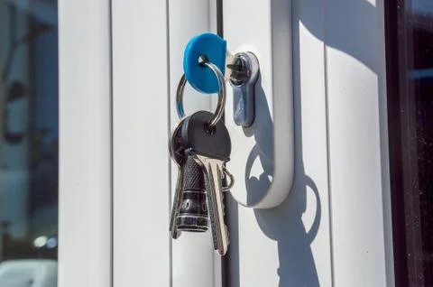 Keys in a door lock Stock Photos
