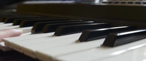 Keys of electric piano close-up anamorphic 5.7K video Stock Footage 304576453