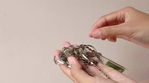 Keys on the hand and counting it Stock Footage 150397854