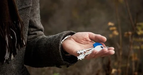 Keys in hand Stock Photos