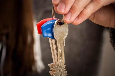 Keys in hand Stock Photos