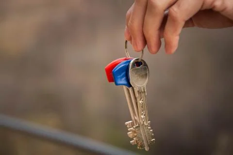 Keys in hand Stock Photos