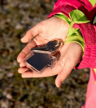 Keys in hand Stock Photos
