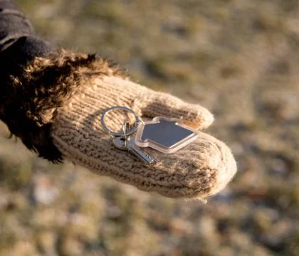 Keys in hand Stock Photos