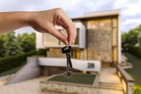 Keys in hand Stock Photos