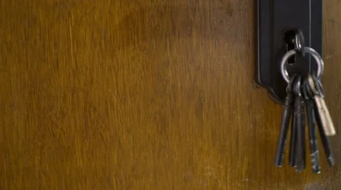 Keys hanging on door Stock Footage