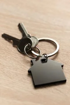 Keys with house shape keychain representing home ownership Stock Photos