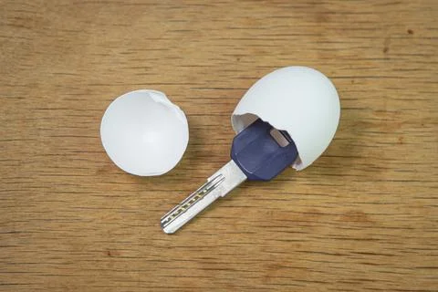Keys inside an eggshell. Keys to the new apartment. Buying a property.  Stock Photos