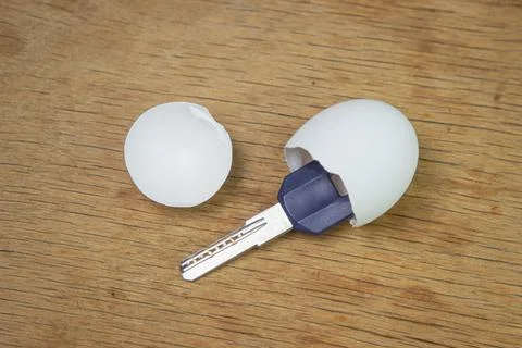 Keys inside an eggshell. Keys to the new apartment. Buying a property.  Stock Photos