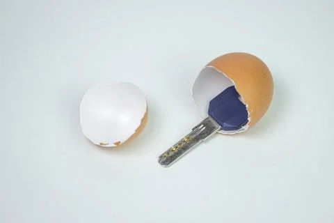 Keys inside an eggshell. Keys to the new apartment. Buying a property.  Stock Photos