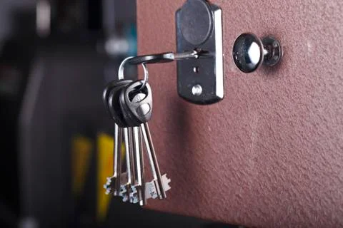 Keys in the keyhole closeup Stock Photos