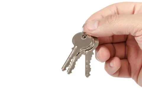 Keys from the lock in hand on white background. Stock Photos