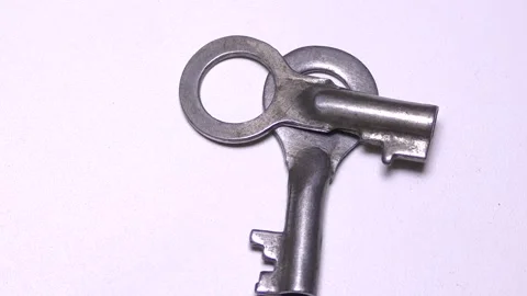 Keys to the lock on a white background Stock Footage 165611040