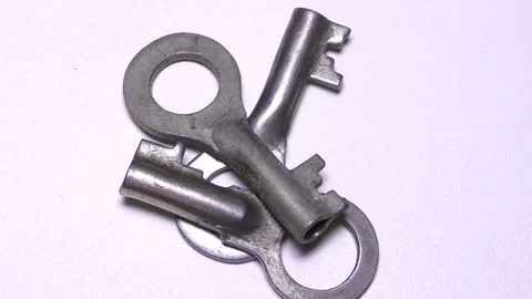 Keys to the lock on a white background Stock Footage 165611113