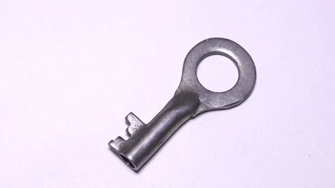 Keys to the lock on a white background Stock Footage 165613192