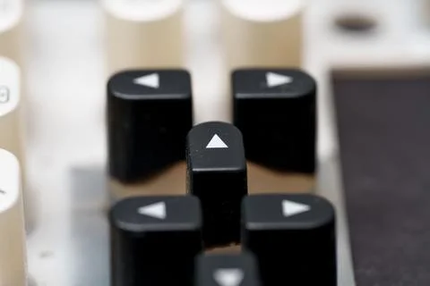 Keys to navigation stand ready on a computer keyboard, pointing the way forwa 스톡 사진