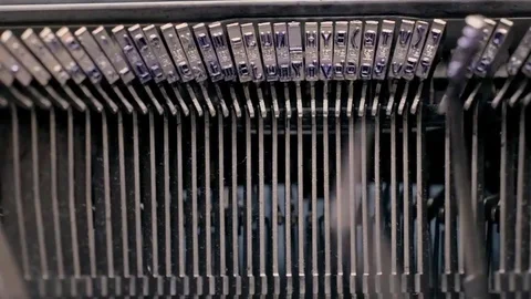 Keys of an old typewriter hitting on paper Stock Footage 73763464