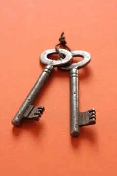 Keys on an orange background Stock Photos