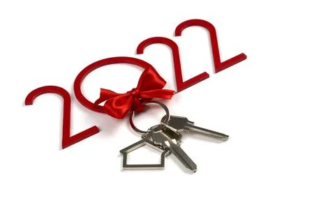 Keys with a red bow. New Year's gift for 2022. Christmas. Buying a property.  Stock Photos