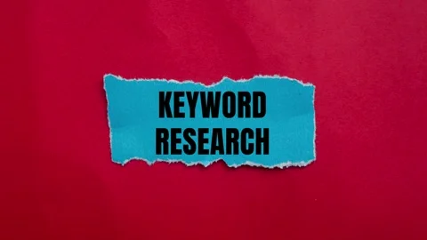 Keyword research message writing on ripped torn blue paper piece 스톡 동영상 282595446