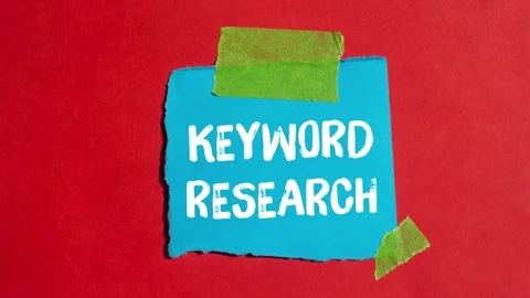 Keyword research message writing on ripped torn paper background 스톡 동영상 331073665