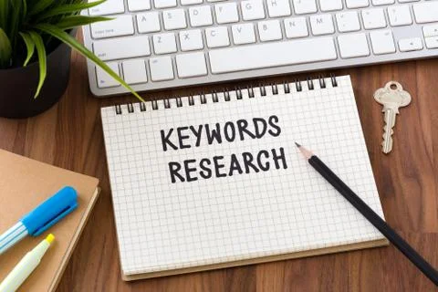 Keywords research words on notebook with computer Stock Photos