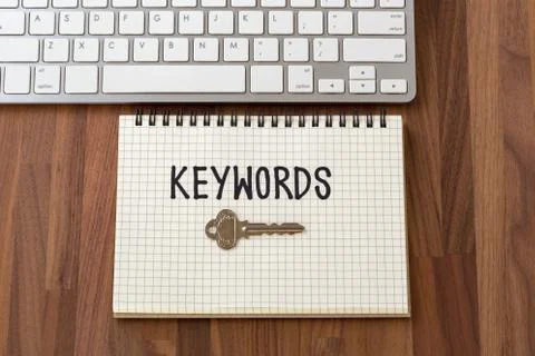 Keywords word with key on notebook with computer keyboard Foto stock