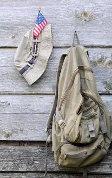 Khaki hat, backpack and us flag Stock Photos