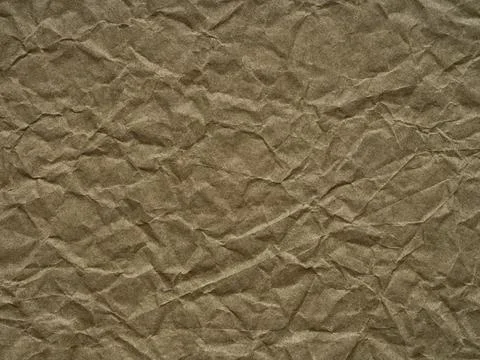 Khaki or olive color crumpled paper texture. Blank grunge page or sheet for Stock Photos