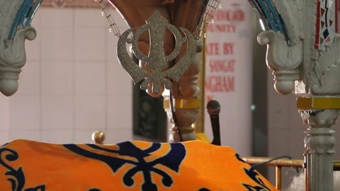 Khanda symbol of Sikhism hanging inside Gurdwara Panja Sahib Stock Footage 86659547