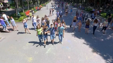 Kharkiv, Ukraine - Jun 18, 2017: aerial of people walk in park at Holi festival Stock Footage 106192553