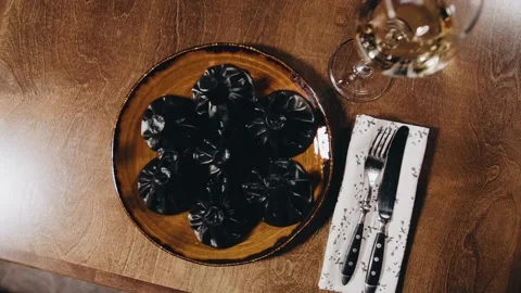 Khinkali on a beautiful table with wine Stock Footage 141482132
