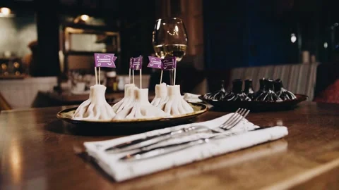 Khinkali on a beautiful table with wine Stock Footage
