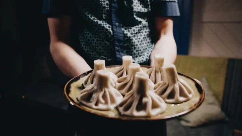 Khinkali on a beautiful table with wine Stock Footage 141482245