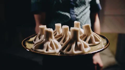 Khinkali on a beautiful table with wine Stock Footage 141482266