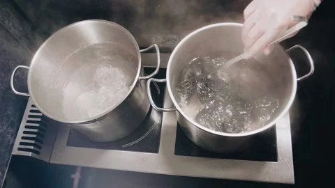 Khinkali in boiling water slow motion Stock Footage